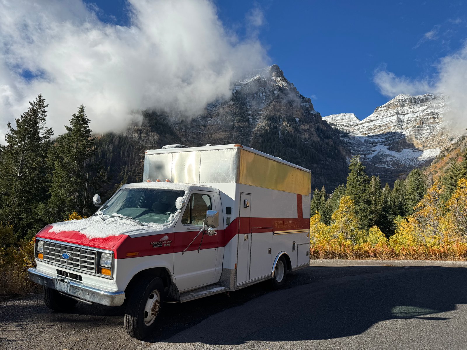 1990 ford e350 ambulance next to mountain
